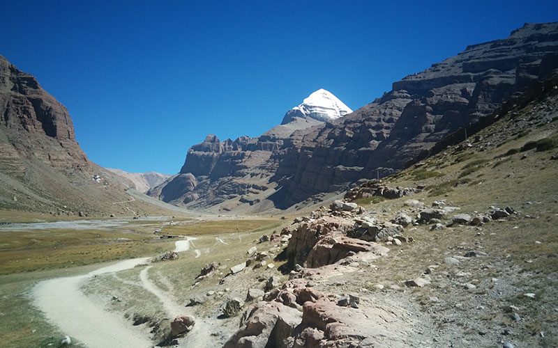 Mount Kailash Inner Kora with monastery nestled in the valley surrounded by dramatic Himalayan peaks.