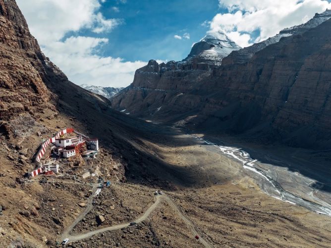 Mount Kailash Inner Kora with monastery nestled in the valley surrounded by dramatic Himalayan peaks.