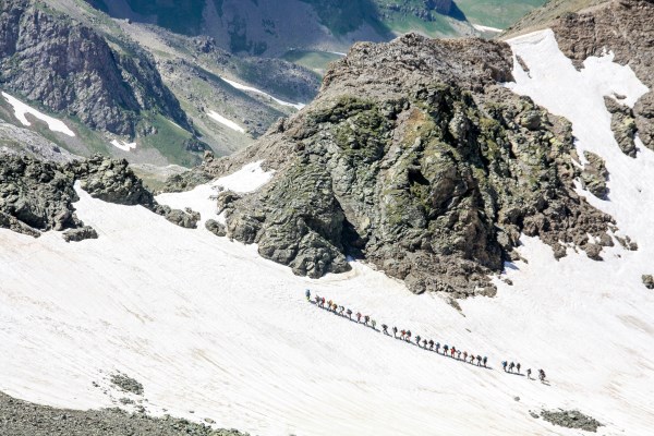 Pilgrims trekking through snow-covered trail to Mount Kailash