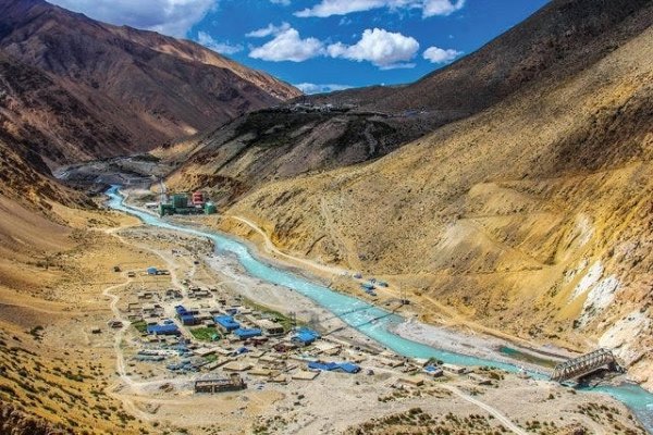 River near Mount Kailash, showcasing the serene landscape and natural beauty of the Kailash Mansarovar region.
