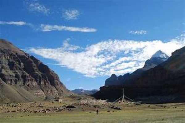 Saga Dawa festival ground with clear view of Mount Kailash and prayer flag pole.