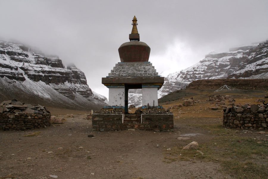 Stupa along the Kailash Mansarovar Yatra trail surrounded by snow-covered Himalayan peaks