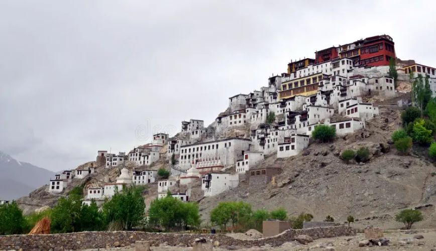 Thiksey Monastery in Ladakh, India — iconic tiered white buildings on a rocky hill with mountain views.
